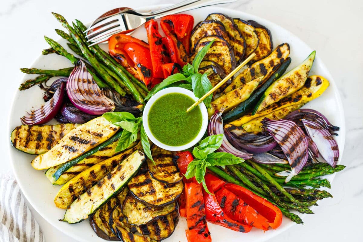 Learn how to make perfectly grilled vegetables with this easy, foolproof recipe. A healthy summer side dish, these smoky, flavorful veggies are caramelized to perfection every time. As a caterer, I’ve prepared this grilled vegetable recipe for hundreds of guests—and it never disappoints. Vegan + gluten-free. 