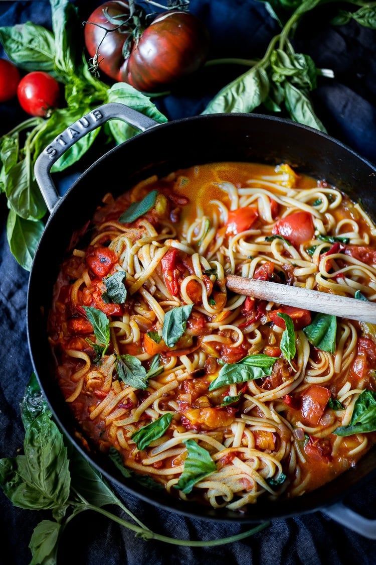 Spaghetti with Fresh Tomato Sauce and Basil in pot with wood spoon. 