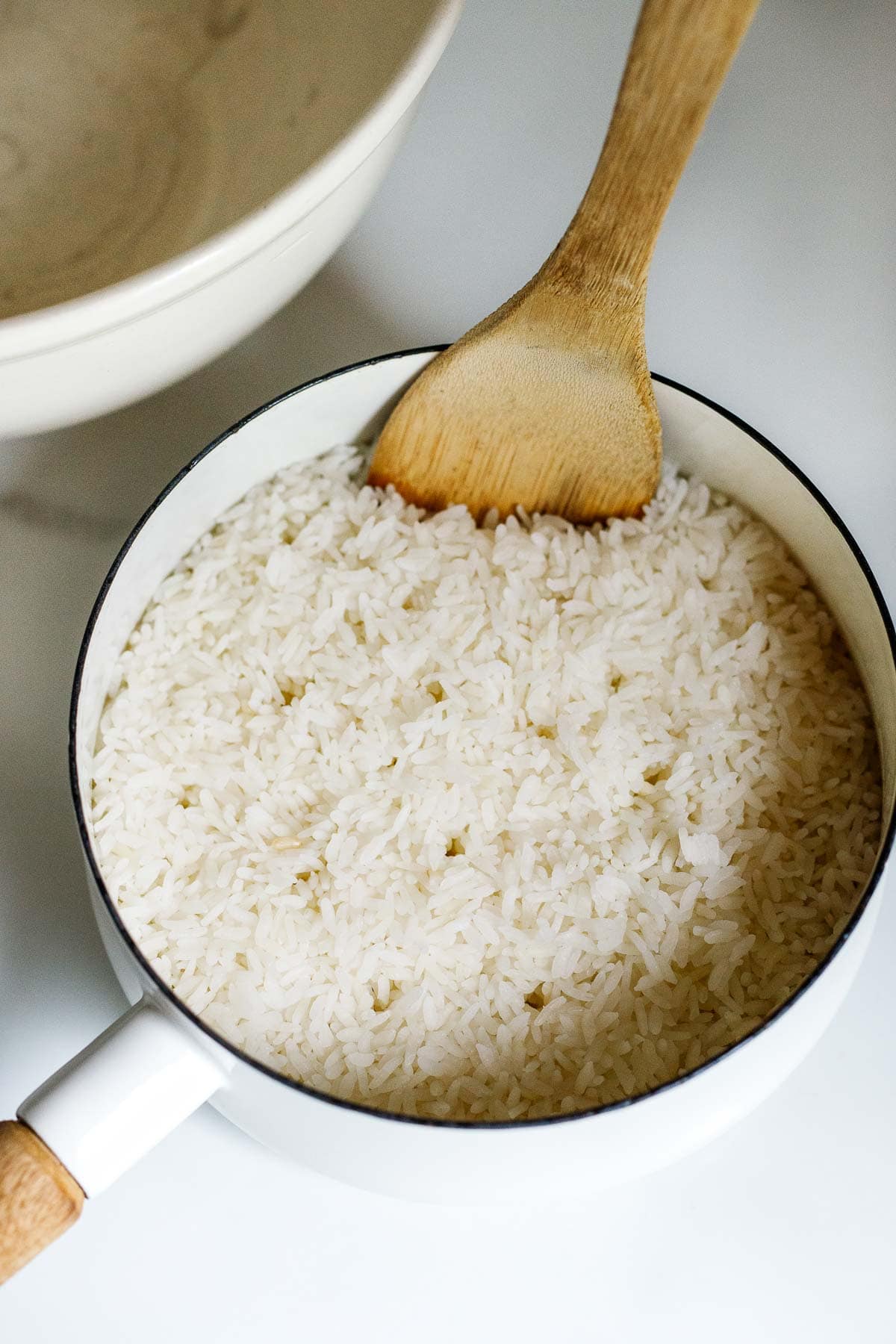 white rice in a white pot. 